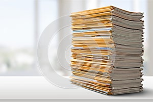 Pile of files in folders on light background