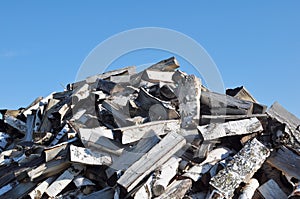 Pile of Firewood and Blue Sky