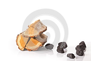 Pile of firewood and pieces of coal