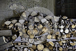 Pile of firewood under a porch