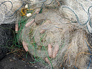A pile of fishing nets on Parangtritis beach, Yogyakarta, Indonesia photo