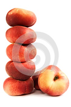 Pile of flat peaches photo