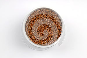 Pile of flax seeds isolated on white background