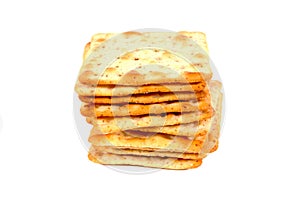 Pile of flour crackers with sugar isolated on a white background