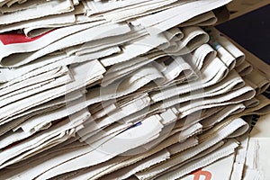 A pile of fold newspapers background