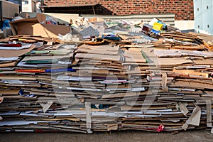 Pile of folded cardboard and paper box stored for recycle