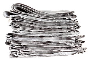 Pile of folded newspapers