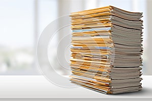 Pile of files in folders on light background photo