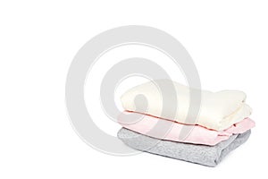 Pile of foldet cloth, isolated on white background. copy space template