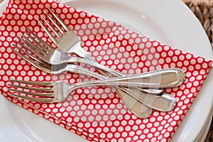 Pile of forks on napkin