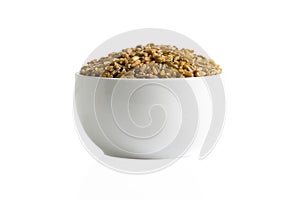A pile of freekeh in a cup closeup
