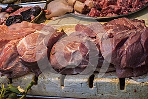 Pile of fresh fresh beef in traditional market stall