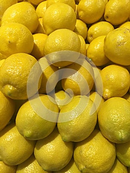 Pile of fresh lemons in a grocery store