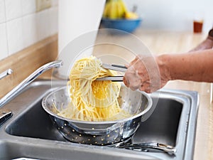 Pile of fresh pasta in strainer