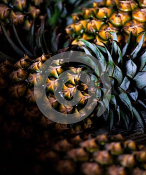 Pile of fresh pineapples sits in the center, invitingly ripe and ready to be enjoyed