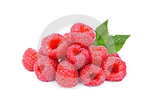 Pile of fresh raspberry with leaf isolated on white background