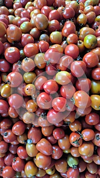 pile of fresh red tomatoes At the traditional market