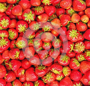 Pile of fresh strawberries as background