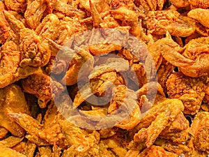 Pile of fried chicken wings for fast food background concept