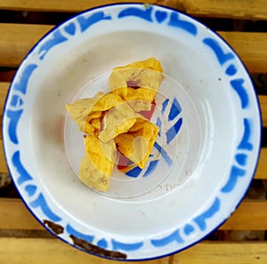 A pile of fried tofu is on the white zink plate