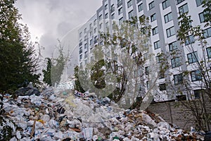 pile of garbage in construction site while construction underway