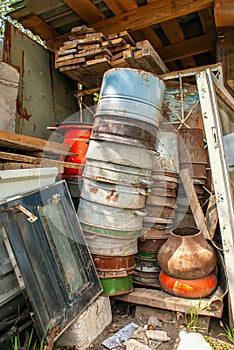 A pile of garbage. piled in a heap of old, rusty, useless things. dump on a farm, village.