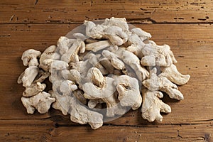 Pile of ginger roots on wooden table