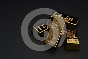 A pile of gold bar a black background.