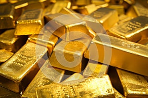 A pile of gold bars bullions close up