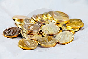 A pile of gold coins isolated on a white background. Treasure hunt. Scattered coins on the white background.