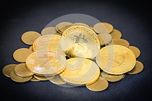 Pile of golden BTC cryptocurrency trading virtual money stock market concept, Bitcoin crypto currency business, Gold bitcoin coin