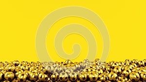 Pile of golden soccer balls on yellow background