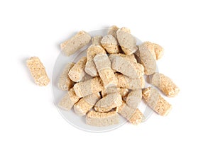 Pile of granulated wheat bran on white background, top view
