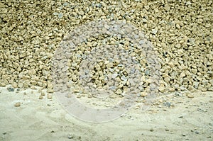 Pile of gravel stone on the street in the city road reconstruction site. photo