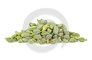 Pile of green cardamom pods isolated on white background. Dried fruits of Elettaria cardamomum