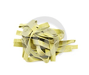 Pile of green fettucce pasta isolated