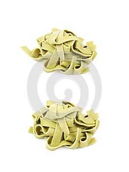 Pile of green fettucce pasta isolated