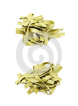 Pile of green fettucce pasta isolated