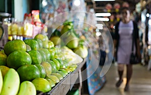 Pile of green orange fruit selling in Thailand`s old market with