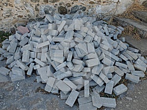 Pile of grey concrete bricks
