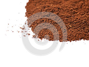 Pile of the ground coffee flakes isolated