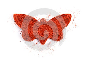 Pile of ground paprika isolated in butterfly shape