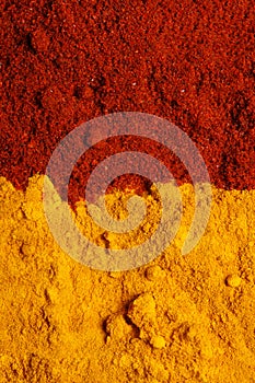 Pile of ground turmeric and paprika