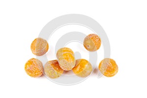 Pile of half-dried yellow cherry plums isolated