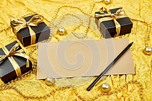 Pile of handmade luxury black gift boxes with gold ribbon DIY decoration, blank sheet paper for greeting text, gold wedding