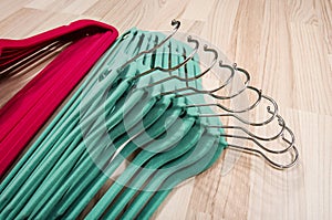 Pile of hangers arranged on the floor.
