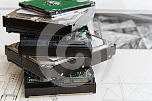 Pile of hard drives at white background