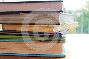 A closeup photo with a pile of books prepared for reading to children