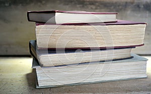 Pile of hardcover books in classroom