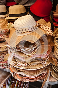 Pile hats stacked on the market.